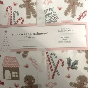 Cashmere and cupcake adorable oblong tablecloth new with tags.  Size 60x84